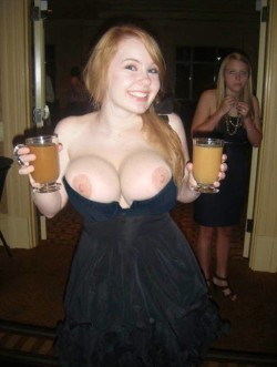 Waitress brings drinks and boobs pop out