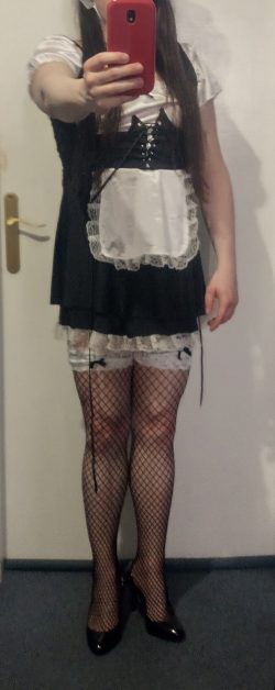 Sissy maid with fishnet maid stockings and heels