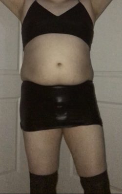 Any guesses as to what’s under this sissy’s leather skirt? Hint: it’s something very very small…