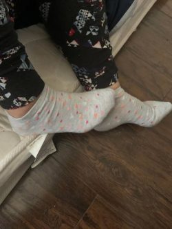 Cute girl feet in gray ankle socks