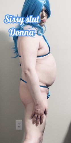 Donna the sleazy sissy slut showing off her blue string bikini.