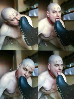 submissive slave licks his owners soles