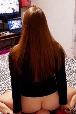 Redhead facesitting while watching TV