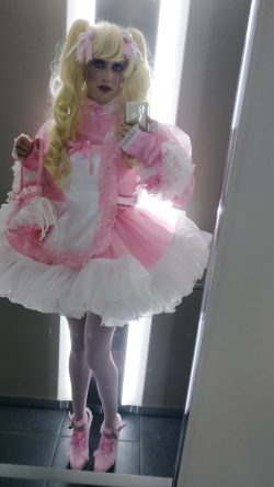 Pink sissy maid Marga in public elevator