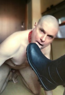 Slave tongue licks dirty boots